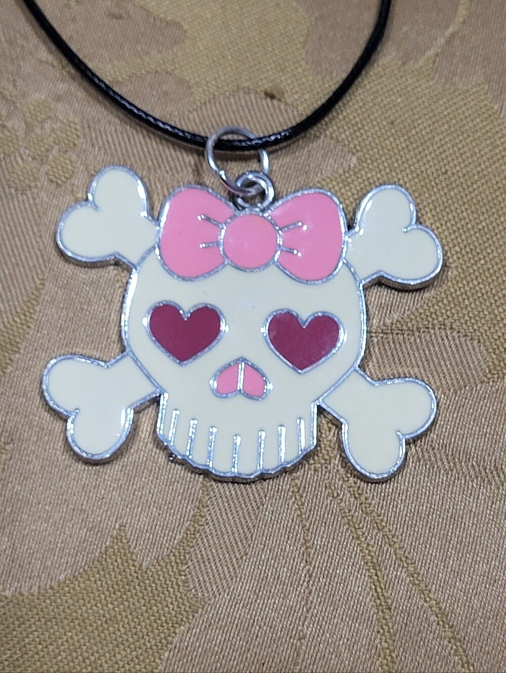 Skull and Crossbones with Pink Bow and Heart Eyes Necklace on Black Cord
